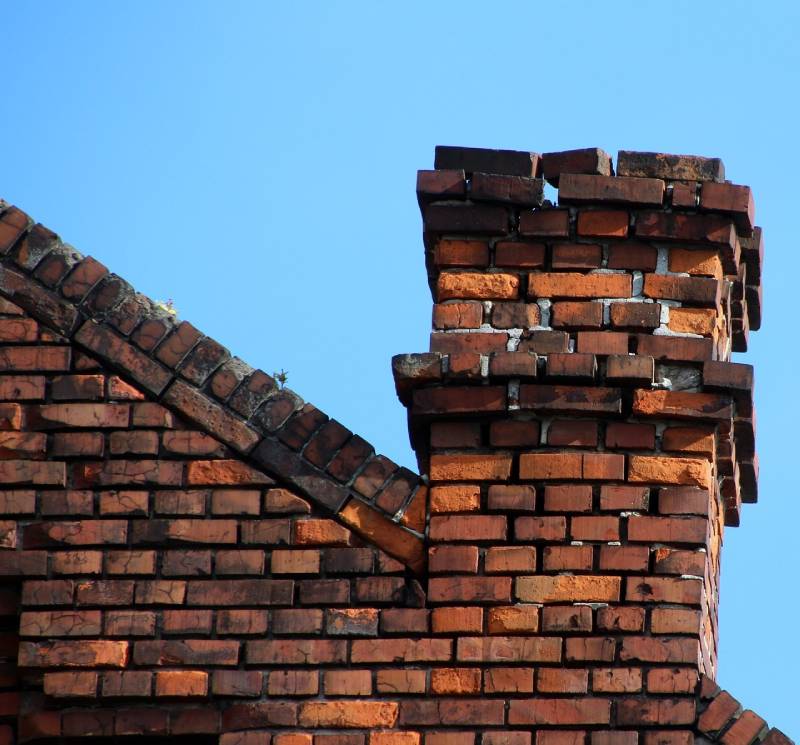 Signs Your Forest Park Home Needs a Chimney Inspection Damaged chimney on an Forest Park home showing cracks and missing mortar